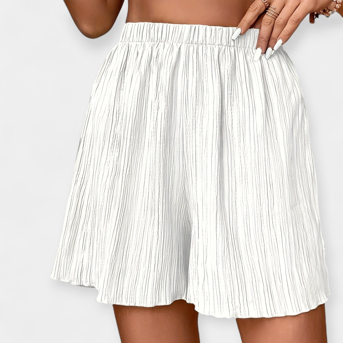 Elegante nederdelshorts med plisseringer