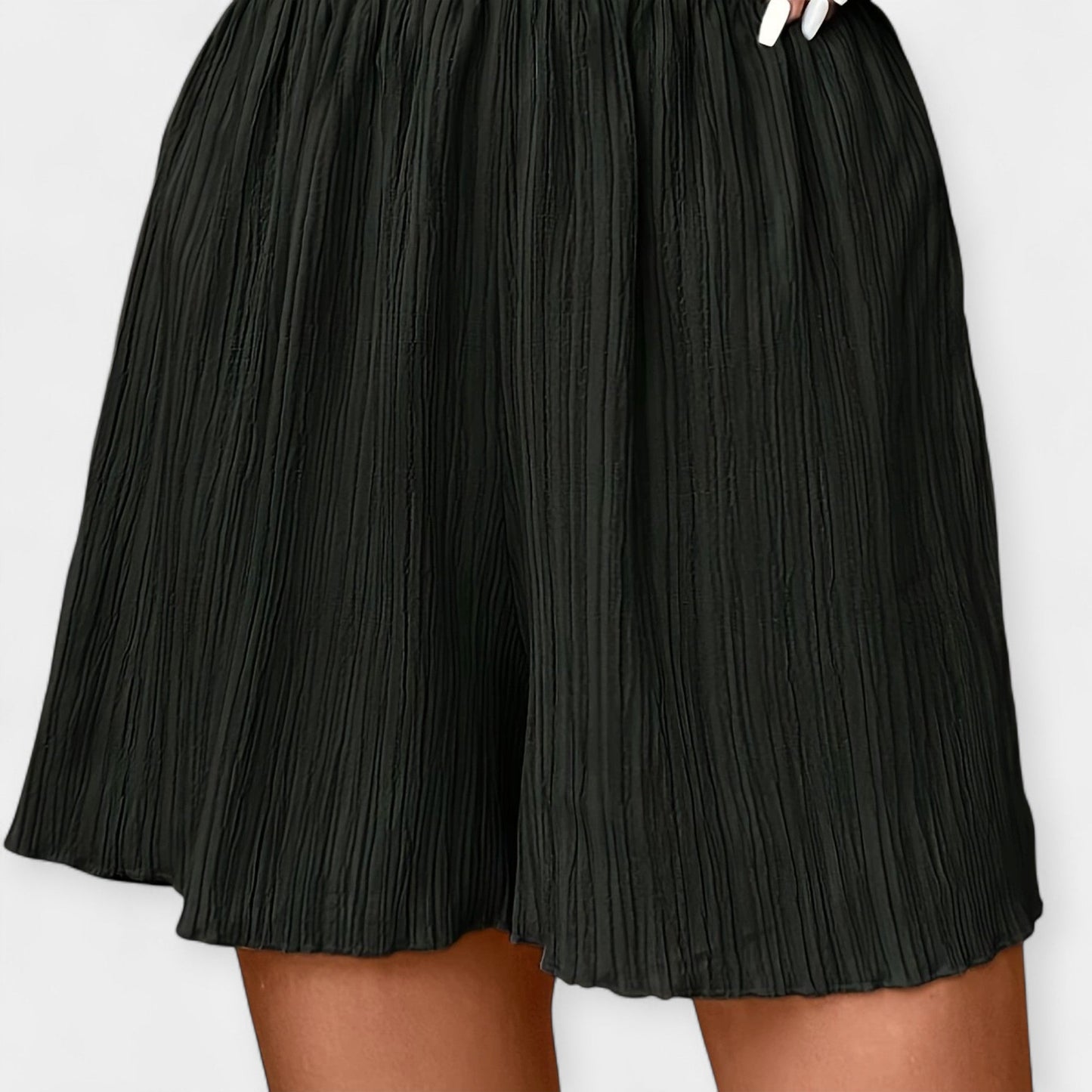 Elegante nederdelshorts med plisseringer