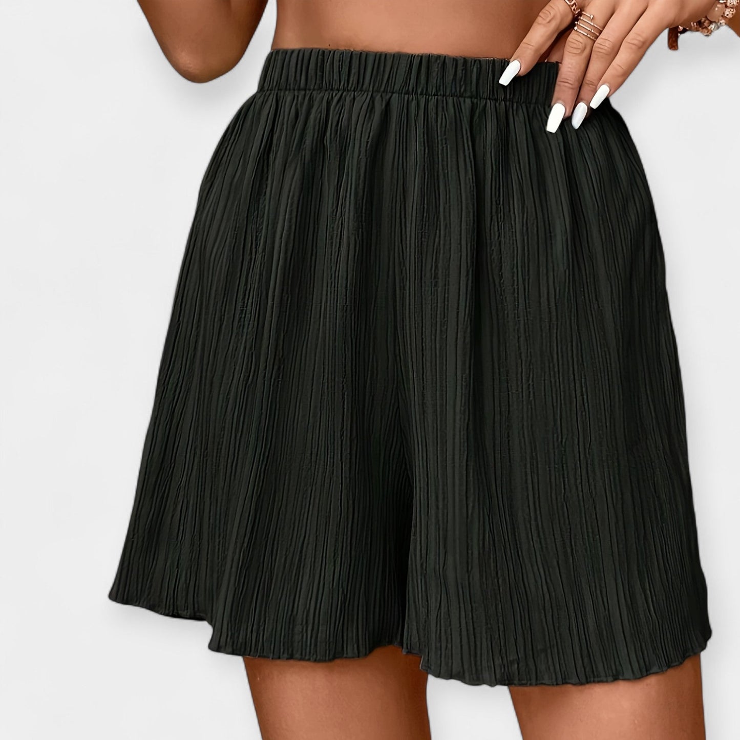 Elegante nederdelshorts med plisseringer