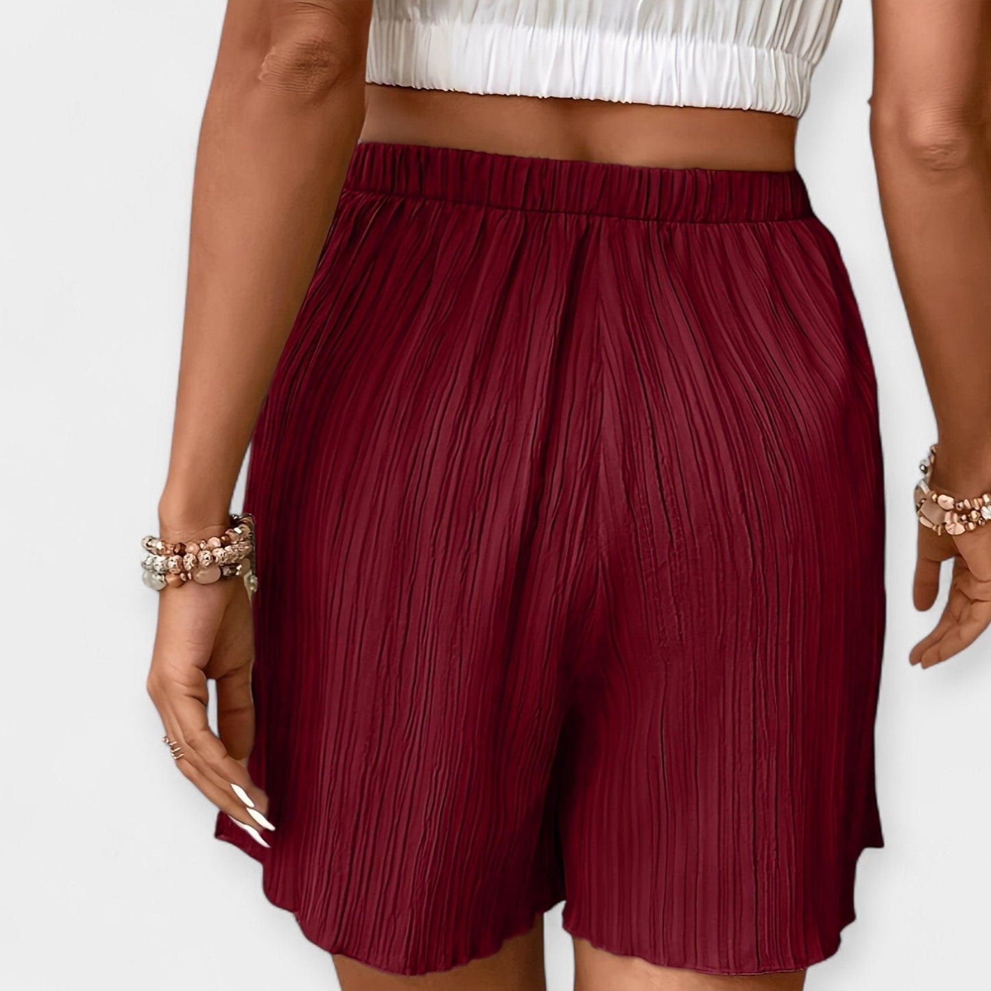 Elegante nederdelshorts med plisseringer